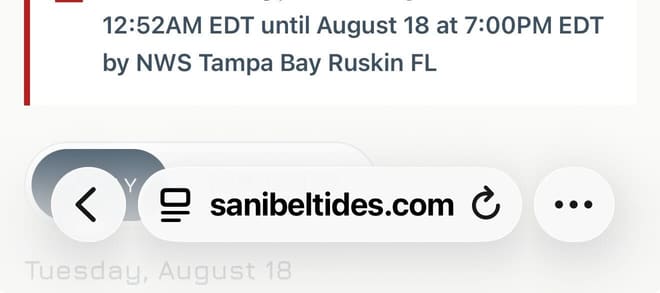 The Safari address bar with sanibeltides.com loaded, showing the three-dot menu button at its right end.